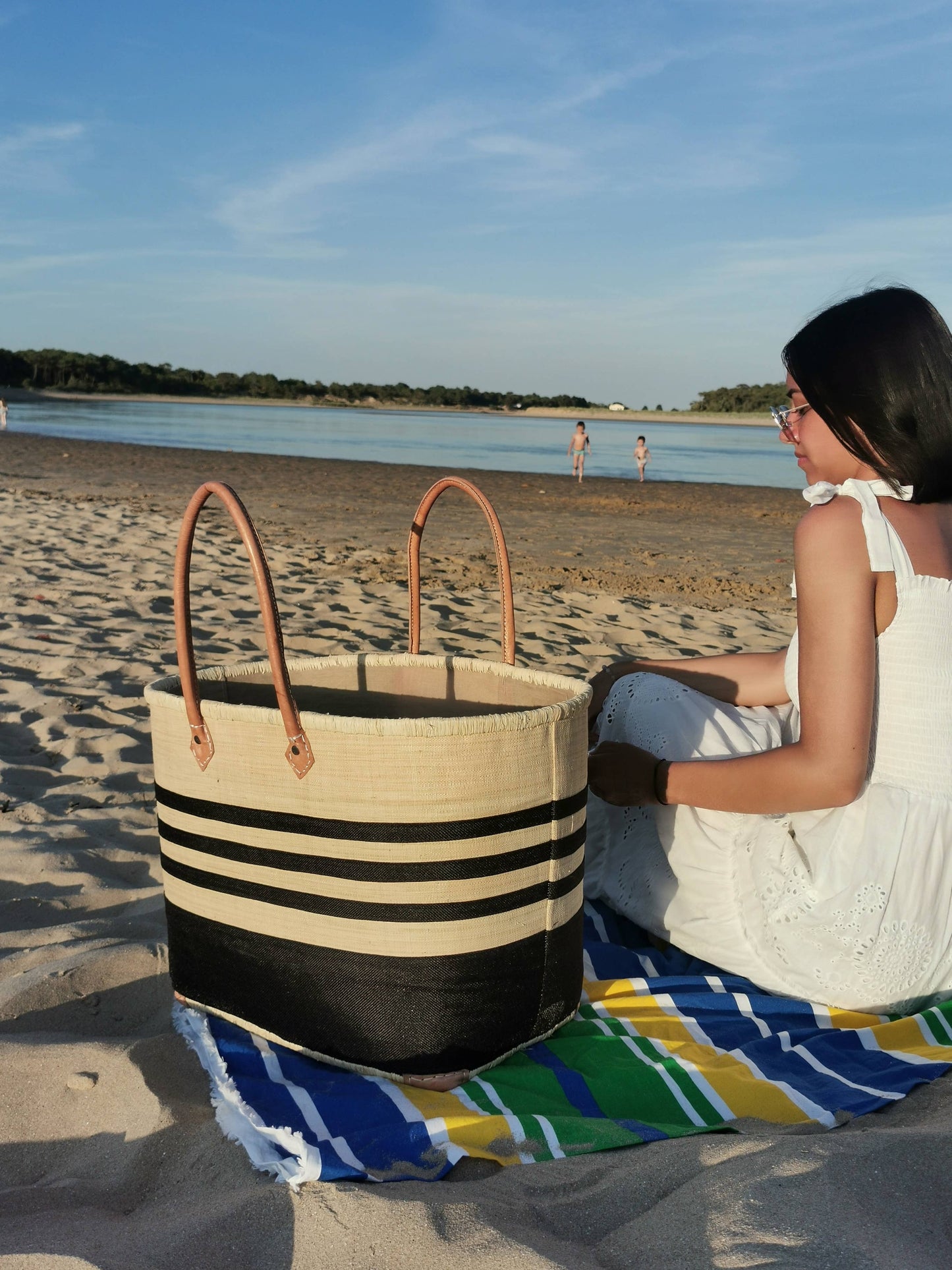 Woven straw tote basket